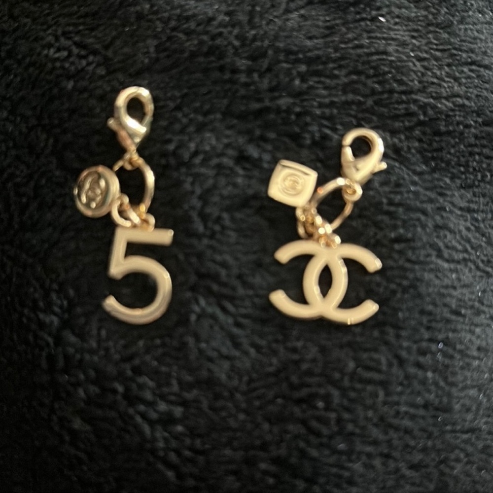 Chanel clip ons. One no 5 and one CC. Authentic clip ons with Chanel fragrance